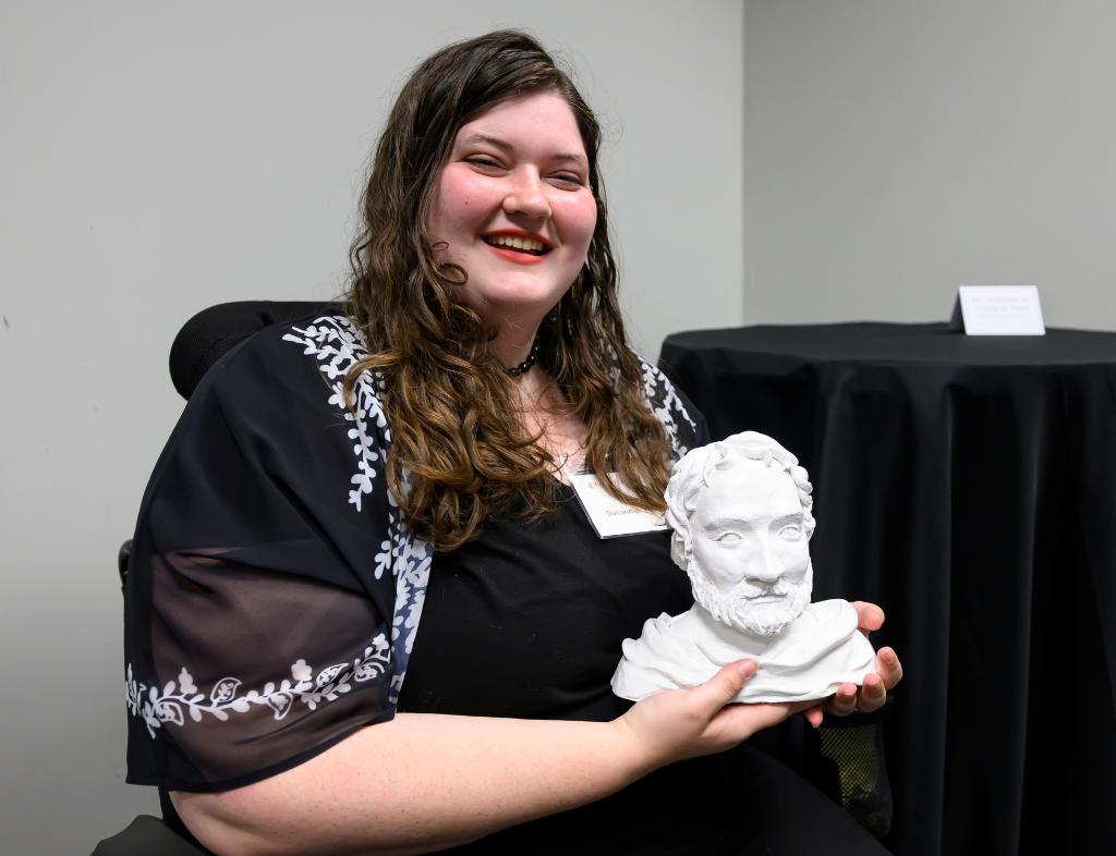Susannah Young poses with piece Dr. Matthew H. Young as Plato. Photo curtesy of Bennet Scarborough Photography